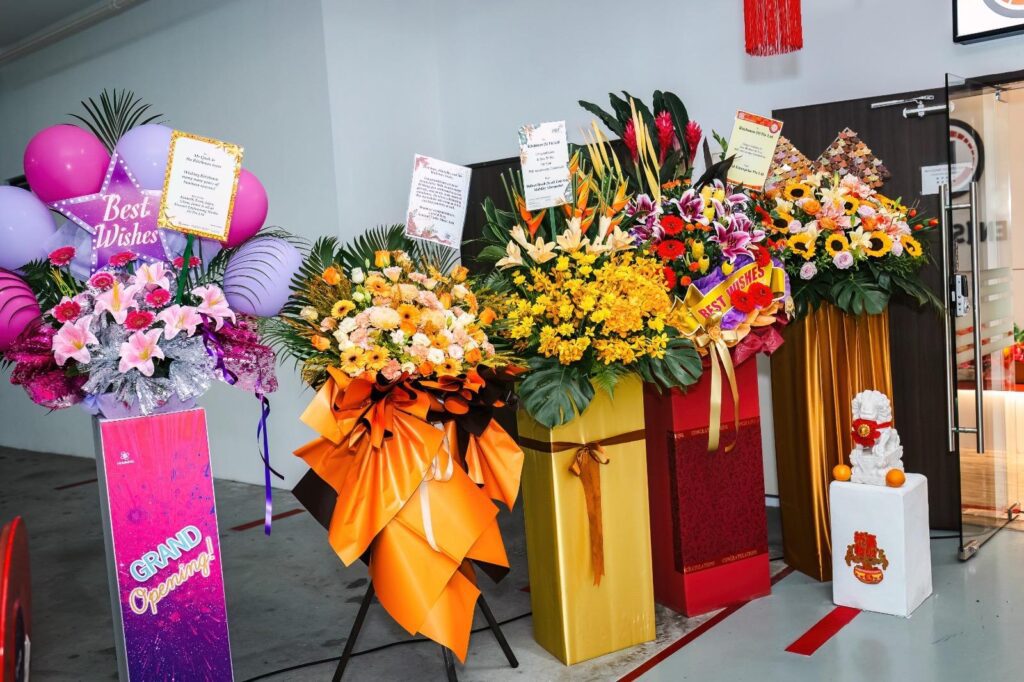 Lots of congratulatory flowers from customers, vendors, and partners.